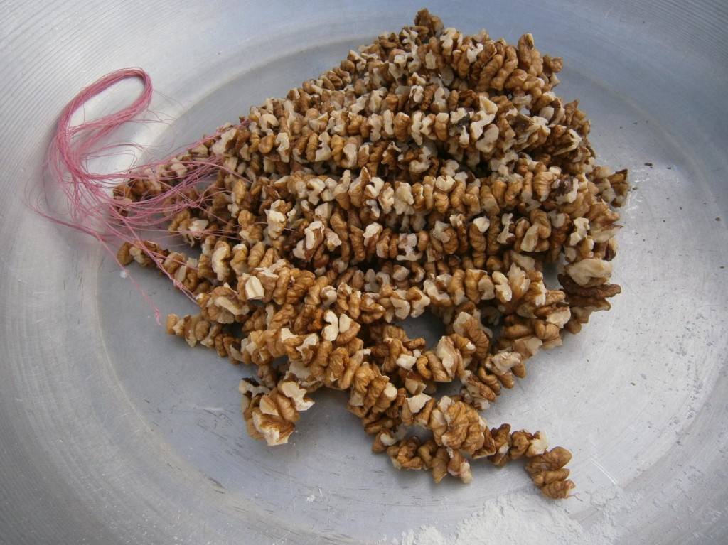 Walnuts threaded into parcels